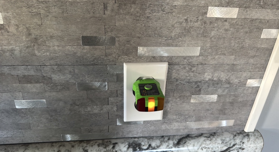 Outlet tested with a receptacle tester during a home inspection